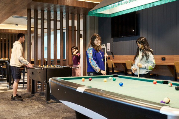 University of Melbourne students studying and playing pool and ping-pong