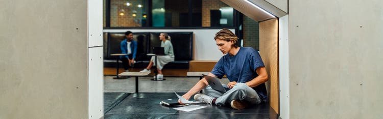 Students in the lobby of The Lofts