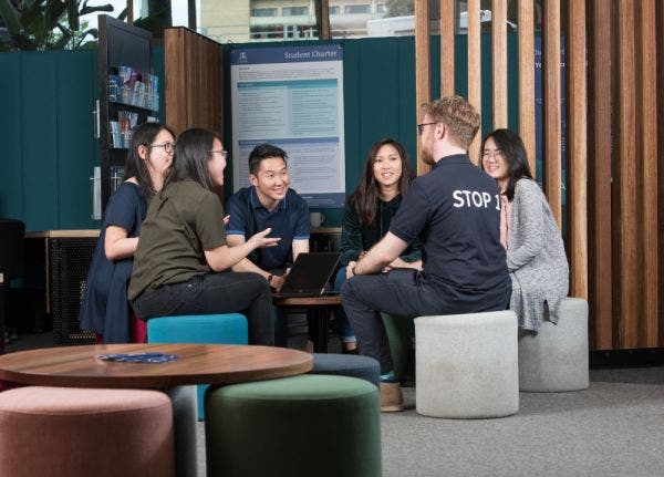 Students getting support from a Stop 1 staff member