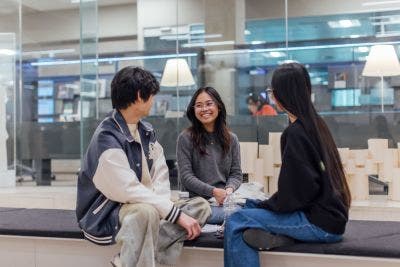 Three students sitting together