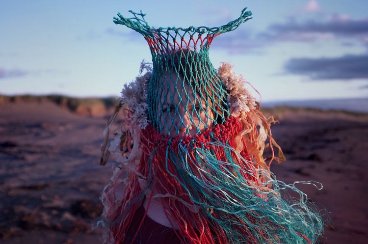 Jordine Cornish, partially obscured by commercial fishing equipment covering head