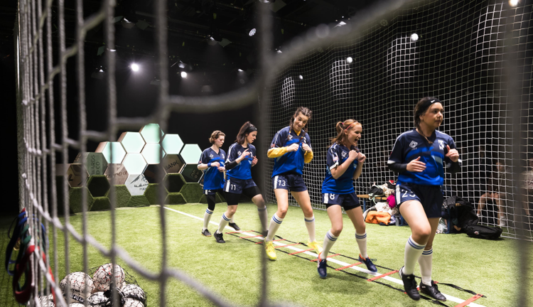 women in soccer outfits for The Wolves production