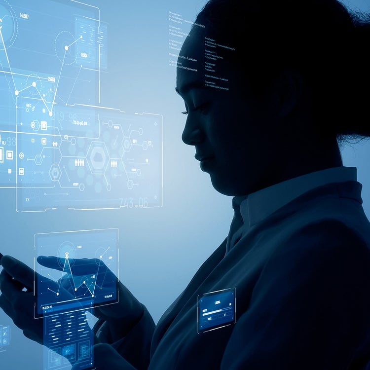 Silhouette of person standing in front of graphic user interface in a business and data context