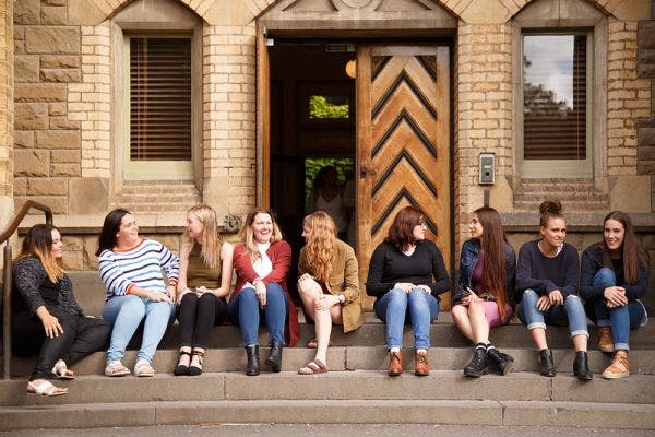 Students talking on steps