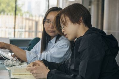 Student looking at a notebook