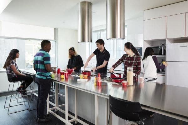Students interacting in a communal kitchen