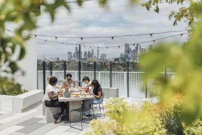 students having BBQ on Lisa Bellear House rooftop