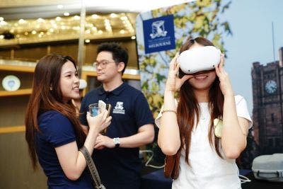 A student is using VR headset at the event.