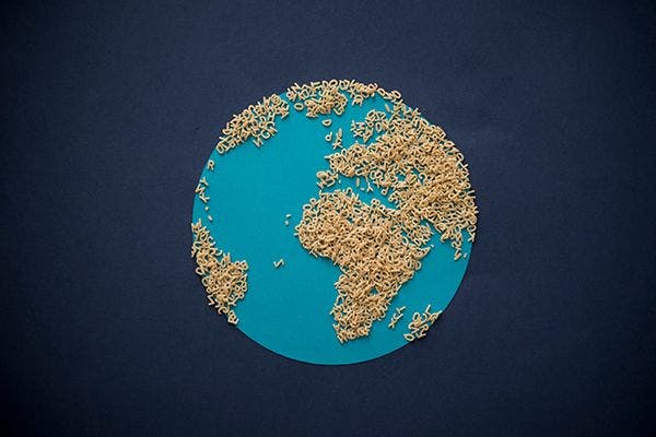 Globe with alphabet pasta making up continents