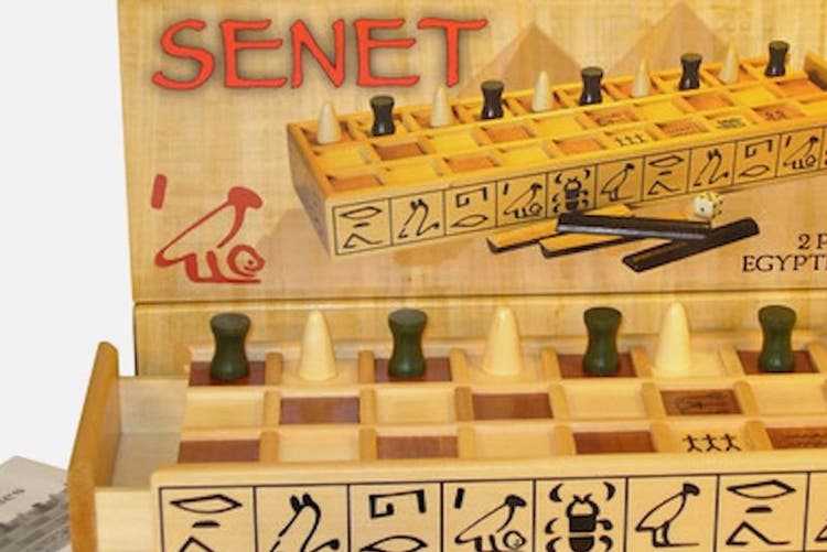 Photo of a Senet board game: wooden board and pieces