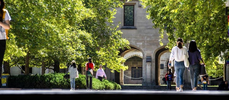 Students walking along the footpath at South Lawn viewed from the staircase