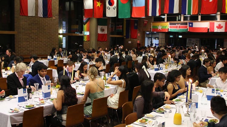Students eating at tables in International House dining hall