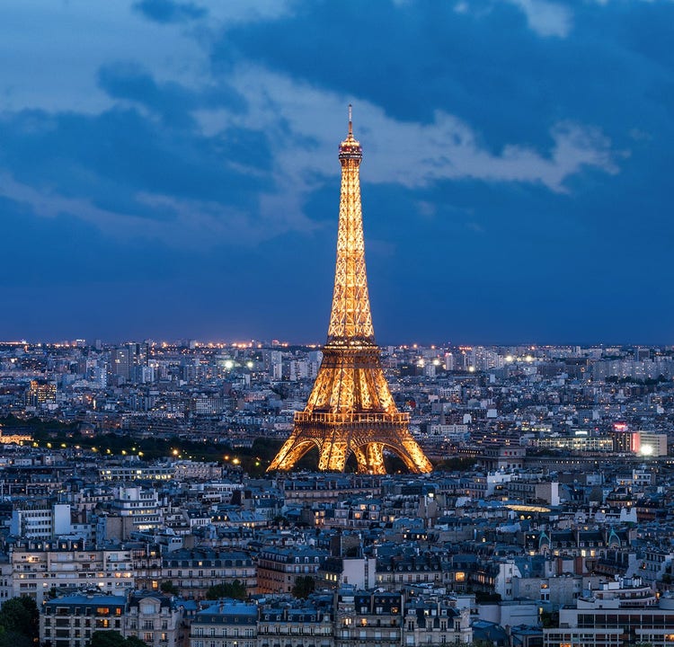 Eiffel tower at night, lit up
