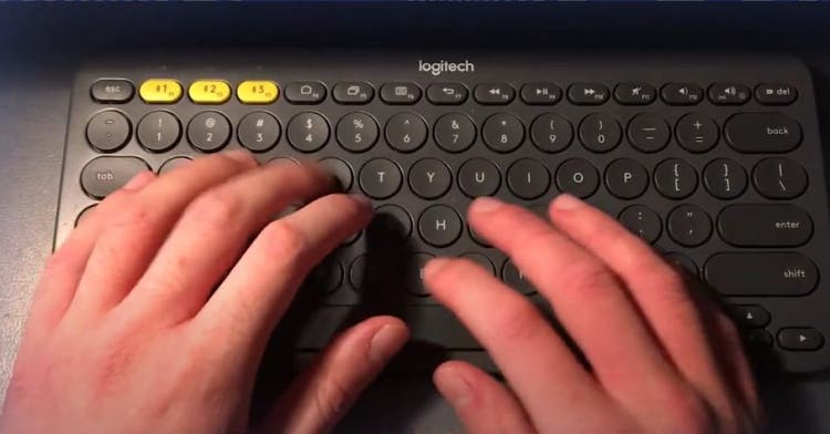 Hands typing on keyboard