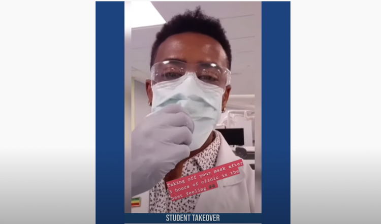 Doctor of Dental Surgery student Elsh in the clinic taking off his face mask after class