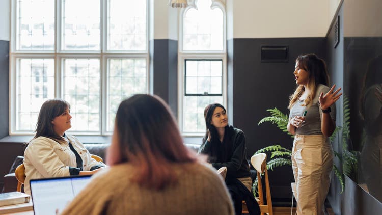 Students listening to a speaker