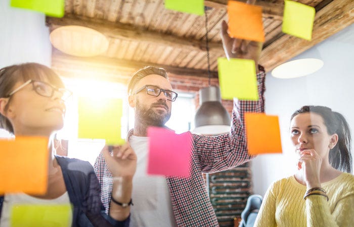 Team using sticky notes during a brainstorm session
