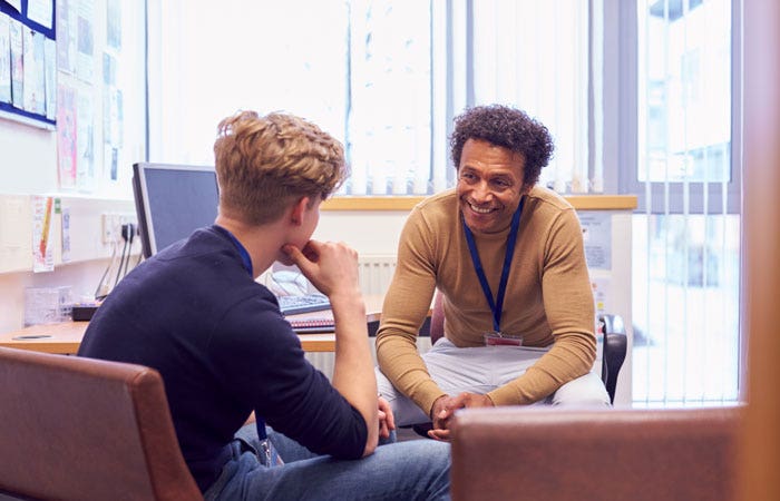 A male councilor having a session with a client