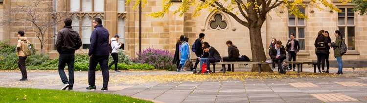 Students walking past a university building
